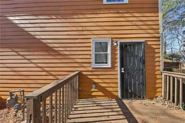 a view of a brick house with stairs and wooden floor