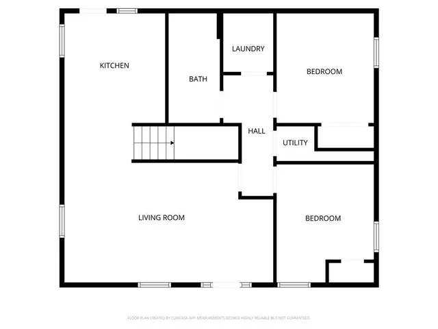 a picture of a bench in front of a gate