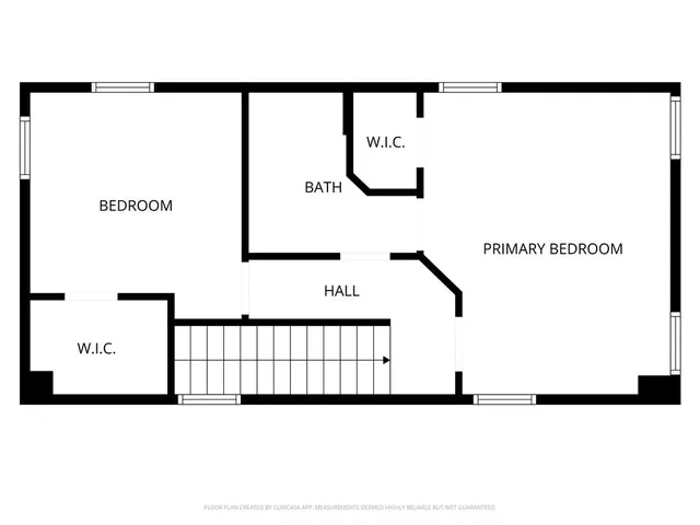a picture of a bench in front of a gate