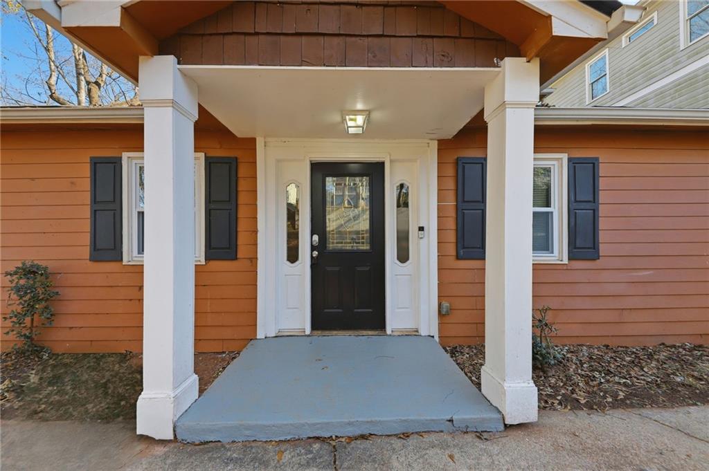 94 Ericson Street Southeast Atlanta, GA 30317 - Photo 4 of 39 a view of a hallway with wooden door
