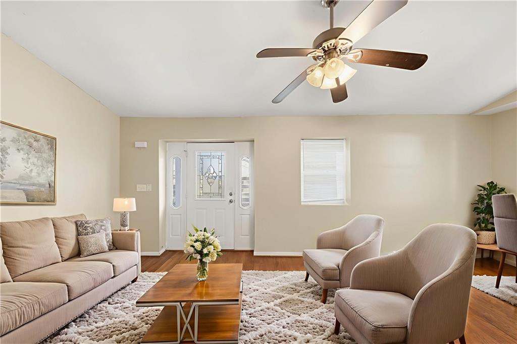 94 Ericson Street Southeast Atlanta, GA 30317 - Photo 5 of 39 a living room with furniture a chandelier and a window