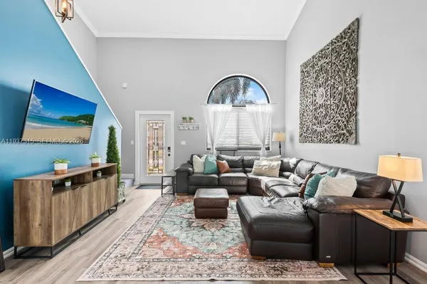 a living room with furniture or couch and a flat screen tv