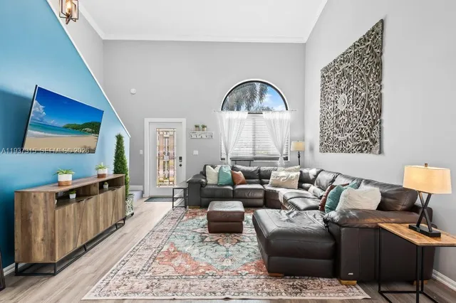 a living room with furniture or couch and a flat screen tv