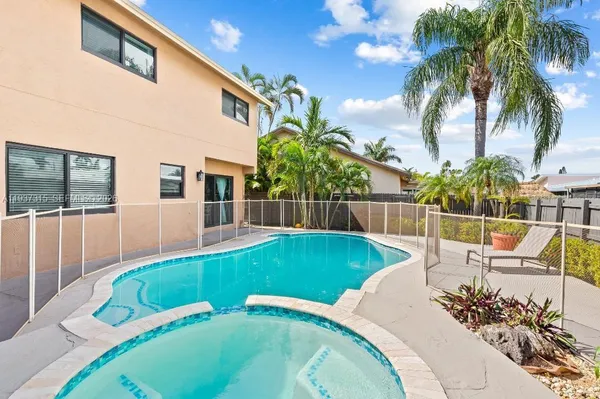 a view of a house with a swimming pool