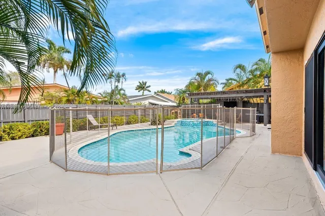 a view of a swimming pool with a lounge chairs