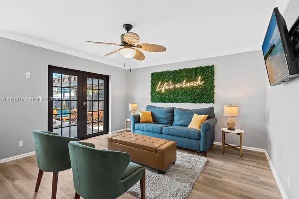 a living room with furniture and a flat screen tv