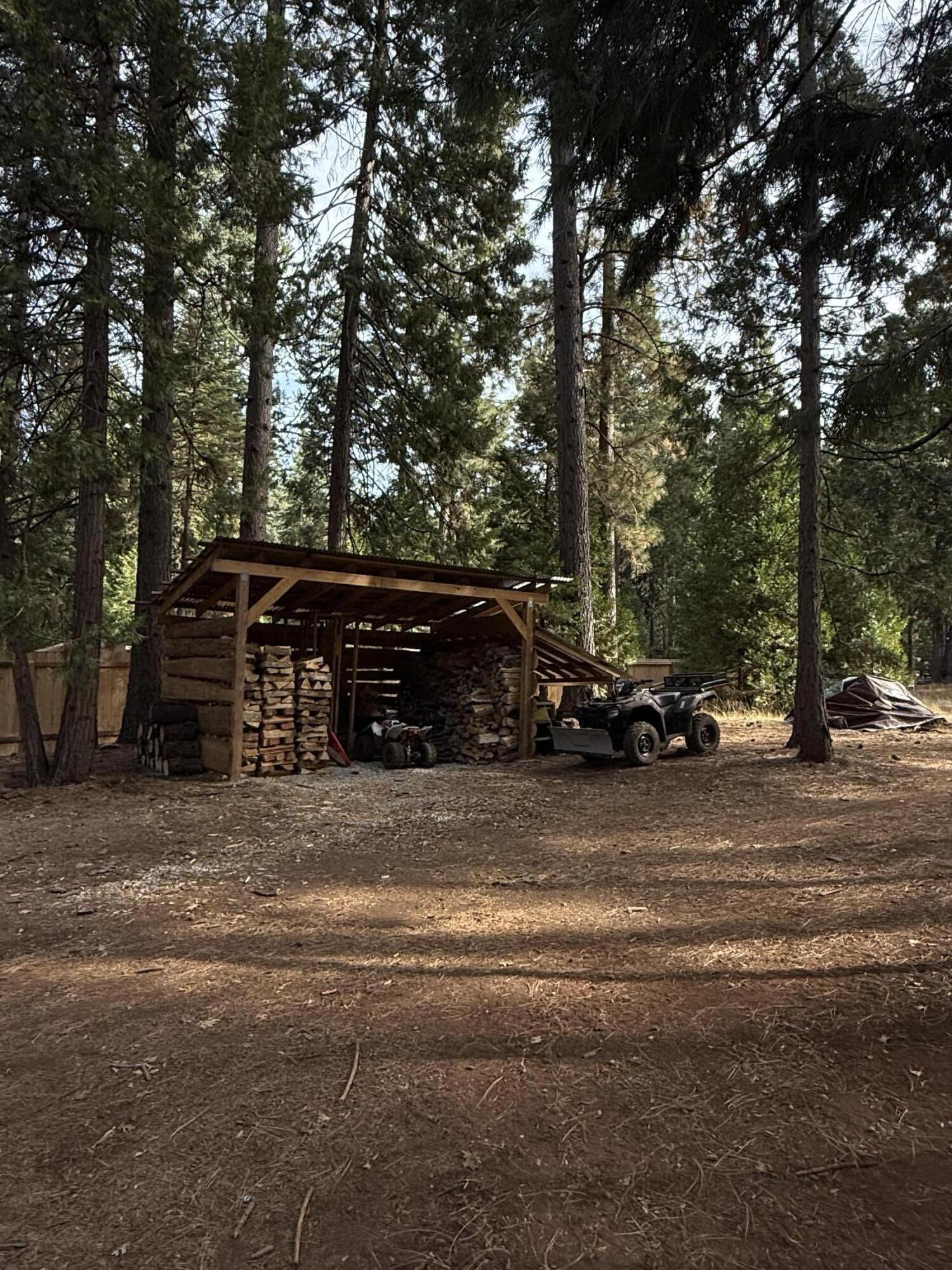 7097 Shasta Forest Drive Shingletown, CA 96088 - Photo 26 of 44 a car parked on the side of the road