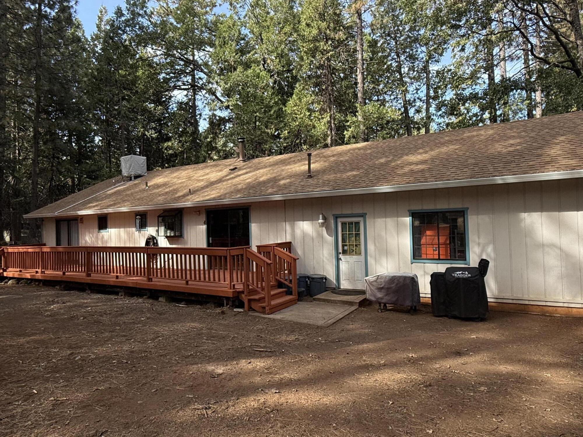 7097 Shasta Forest Drive Shingletown, CA 96088 - Photo 30 of 44 a view of a house with a balcony and sitting area