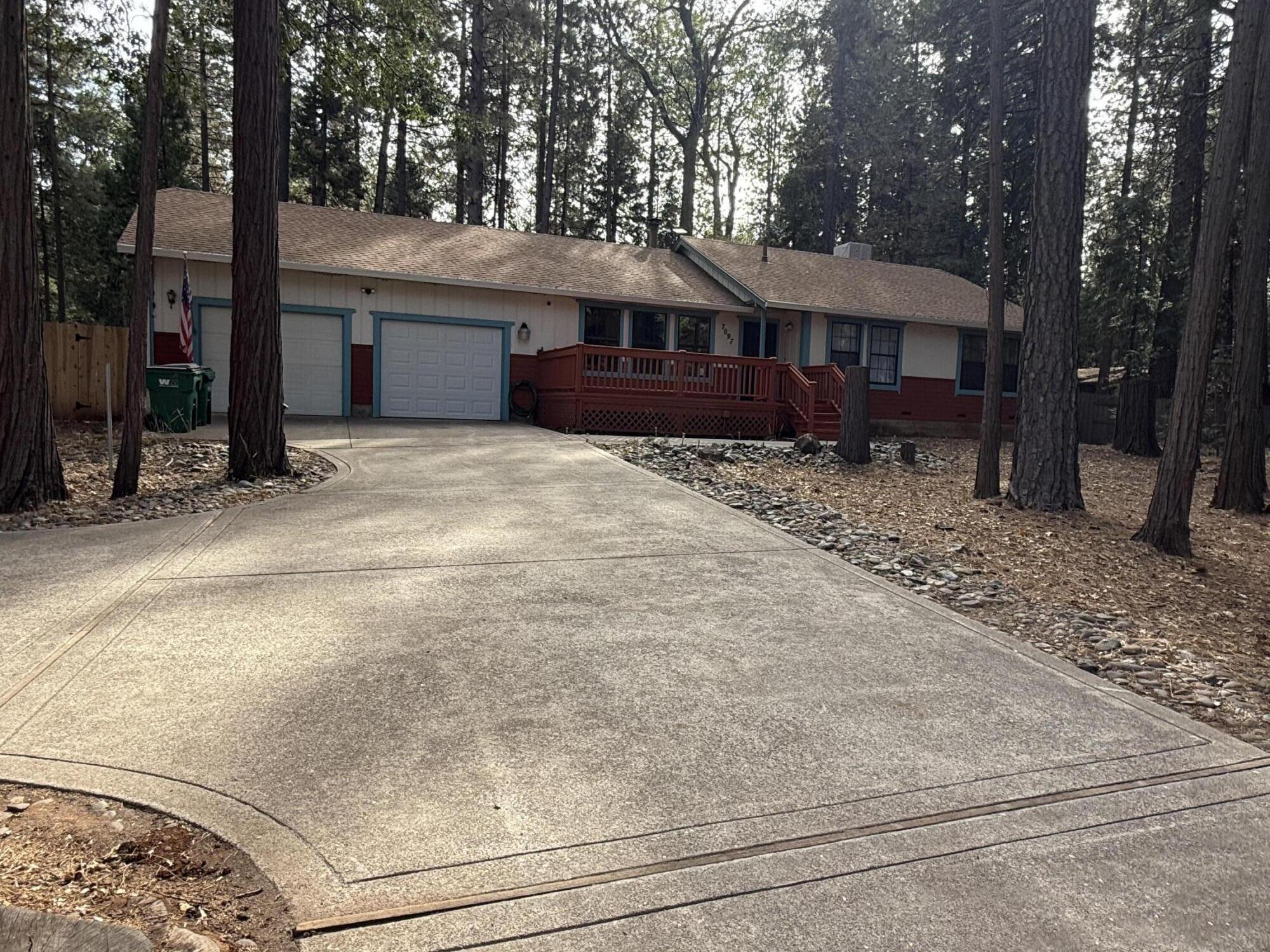 7097 Shasta Forest Drive Shingletown, CA 96088 - Photo 3 of 44 a front view of a house with a yard