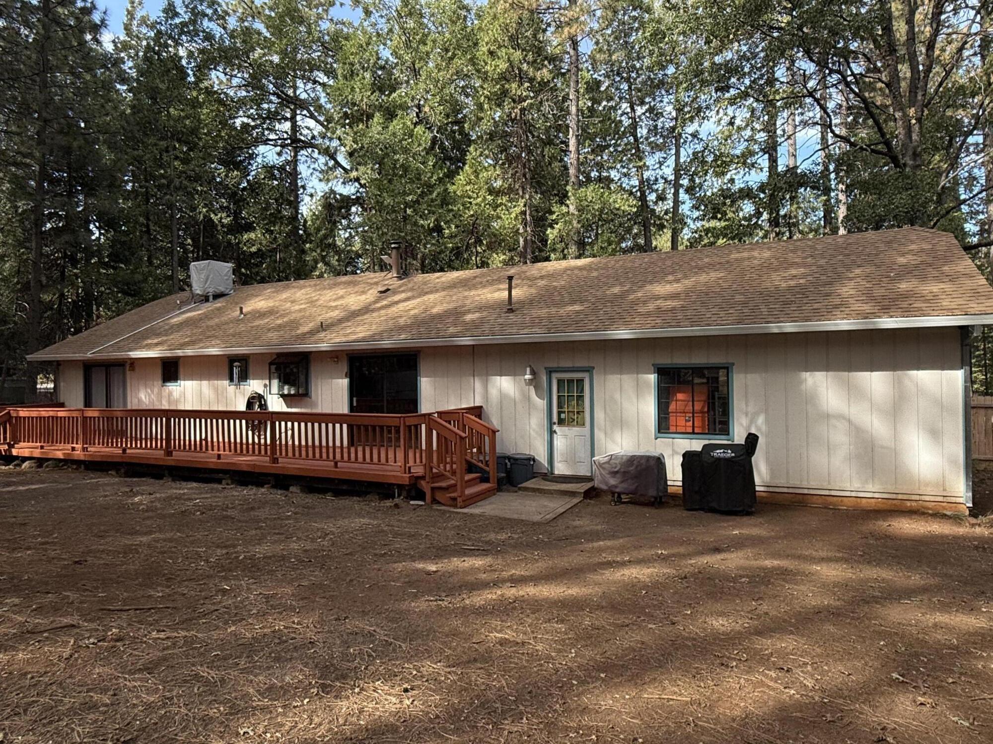 7097 Shasta Forest Drive Shingletown, CA 96088 - Photo 31 of 44 a view of a house with a yard and sitting area