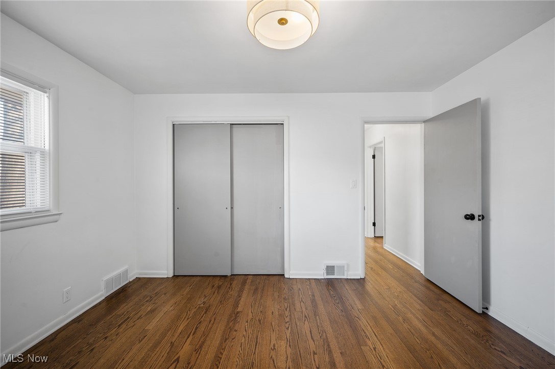 15857 Henley Road Cleveland, OH 44112 - Photo 29 of 42 Unfurnished bedroom with a closet and dark hardwood / wood-style floors