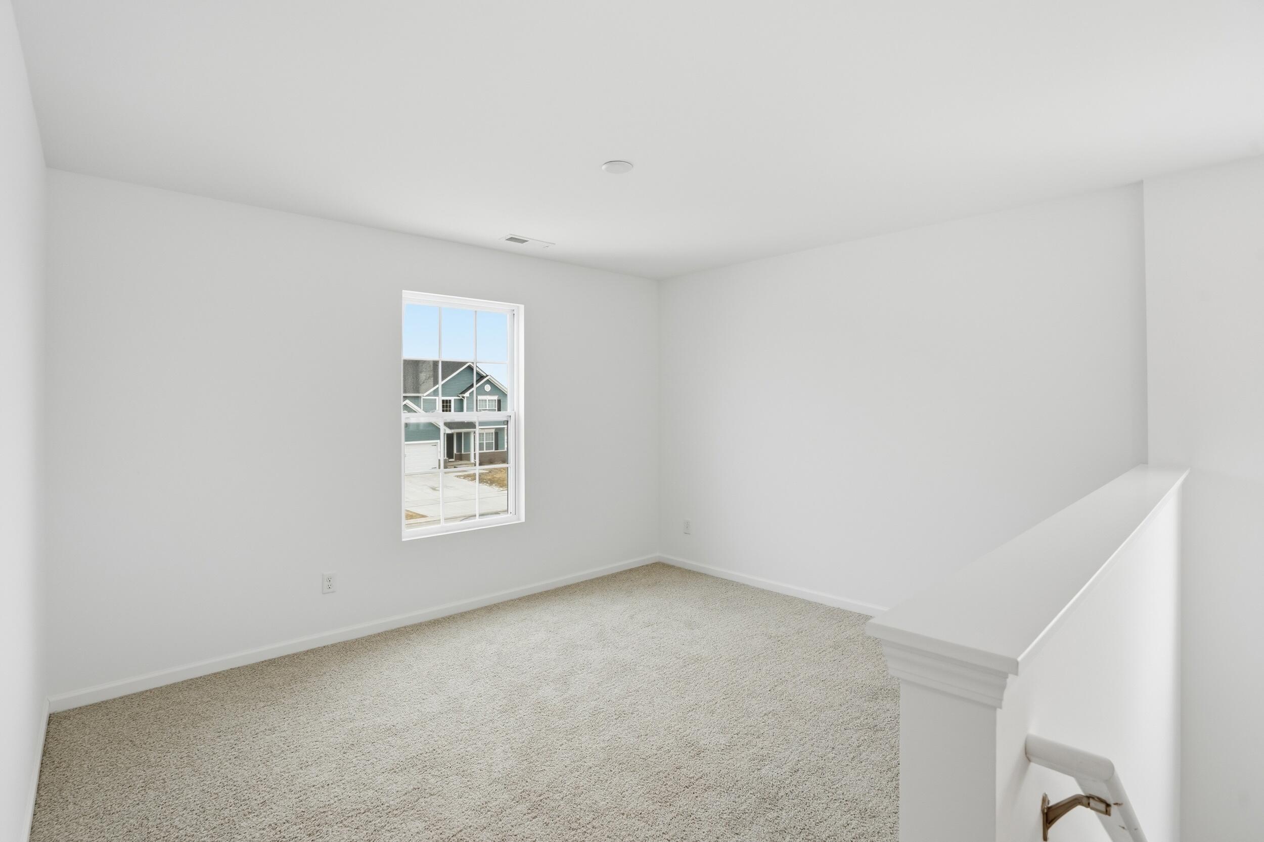 6587 East 104th Avenue Winfield, IN 46307 - Photo 19 of 34 a view of an empty room with window