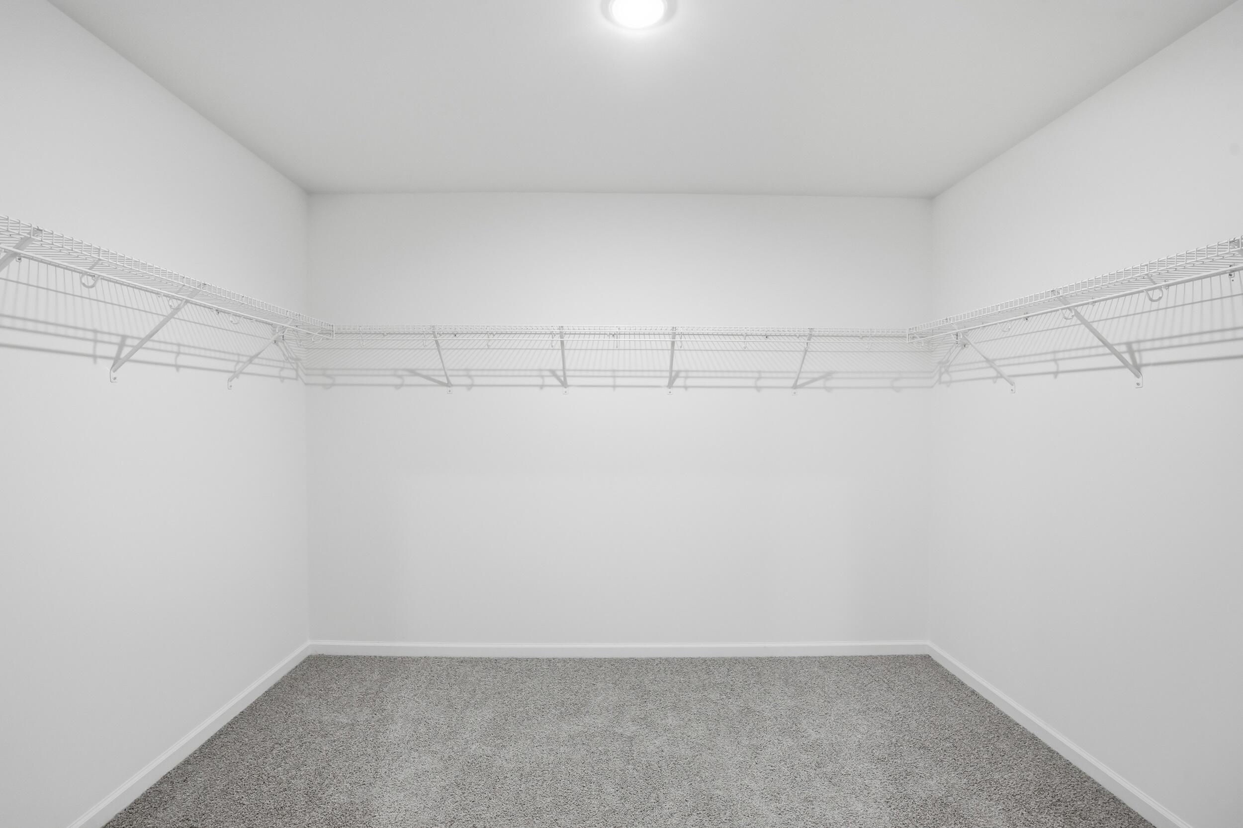 6587 East 104th Avenue Winfield, IN 46307 - Photo 23 of 34 a view of a room with racks on the wall