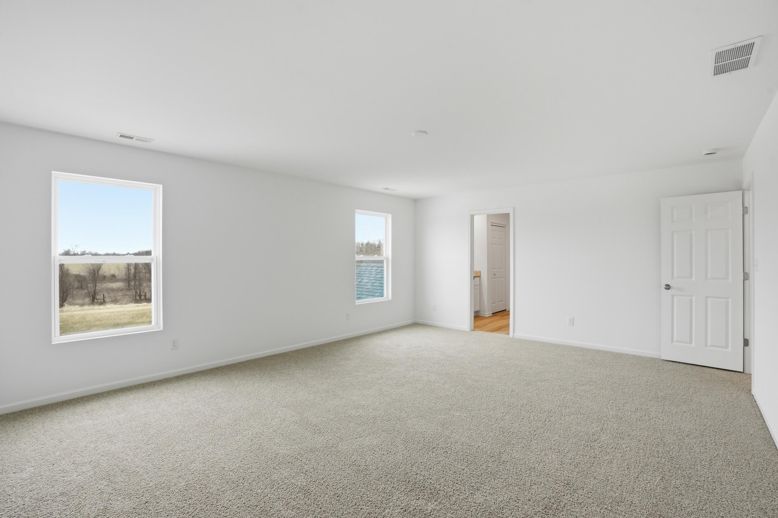 6587 East 104th Avenue Winfield, IN 46307 - Photo 25 of 34 an empty room with windows