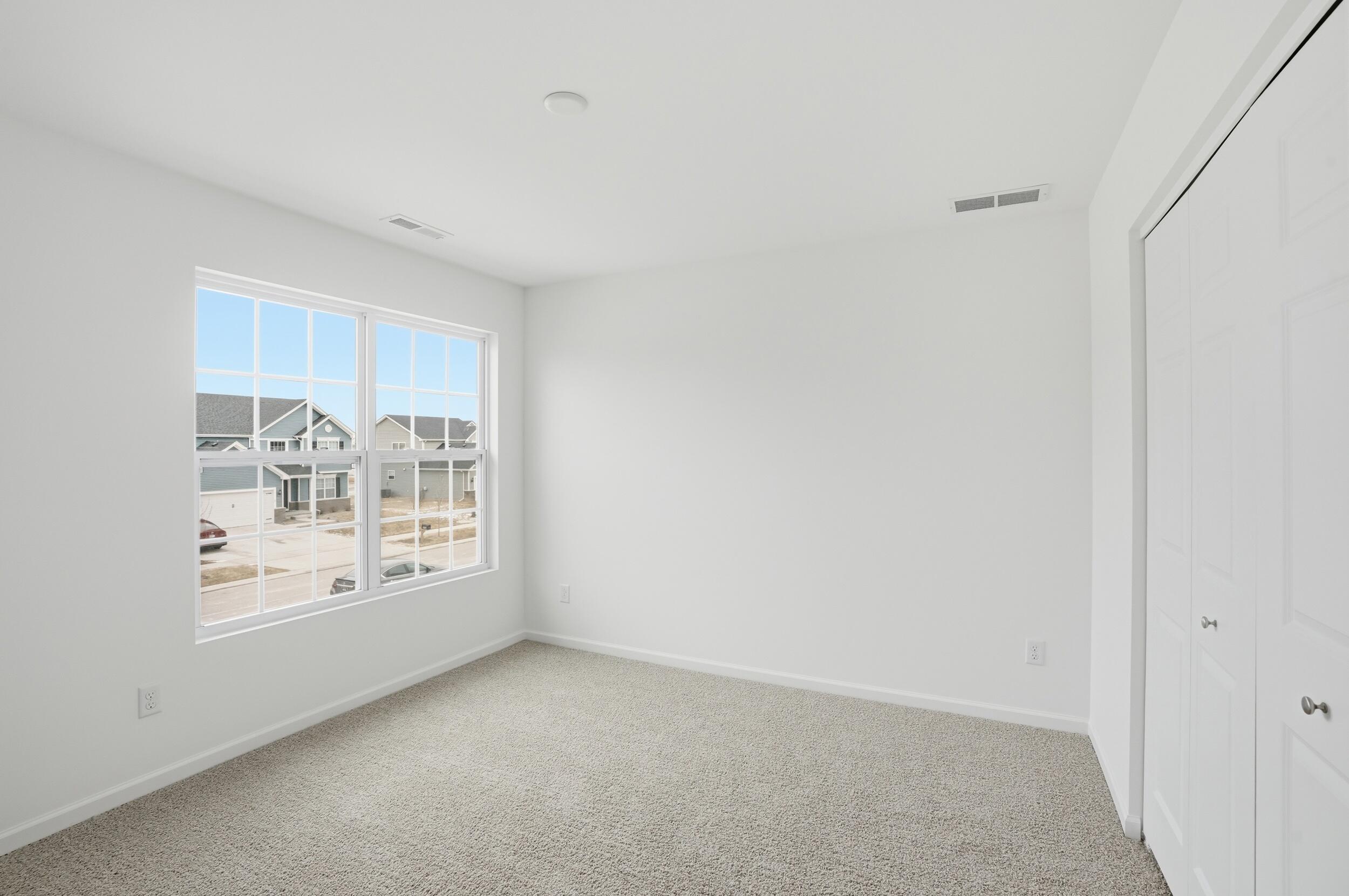 6587 East 104th Avenue Winfield, IN 46307 - Photo 27 of 34 a view of an empty room with a window