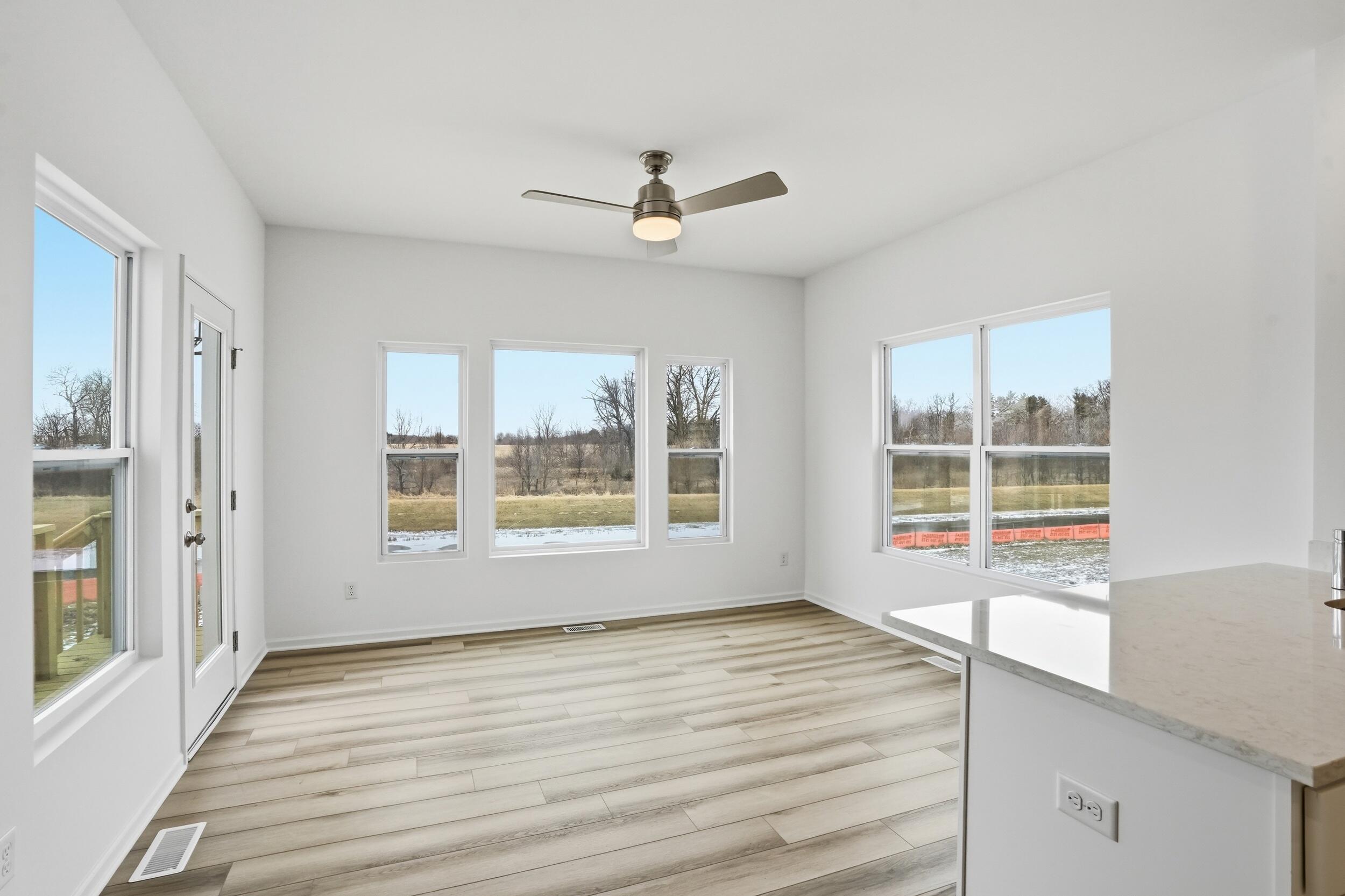 6587 East 104th Avenue Winfield, IN 46307 - Photo 8 of 34 a view of an empty room with a window