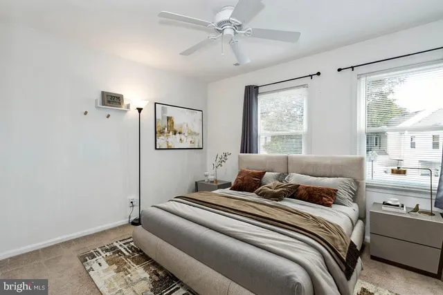 a bedroom with a large bed and a window