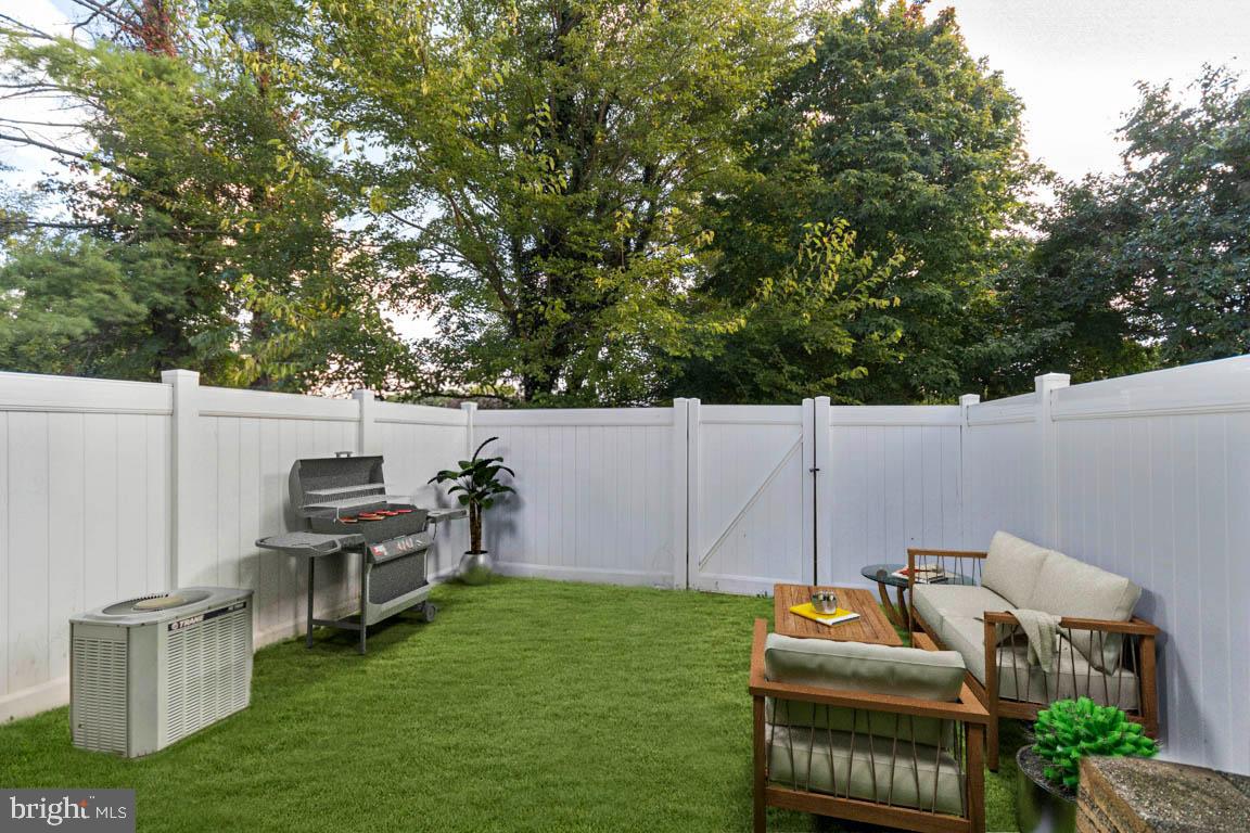 611 Madison Court, Unit 611 Stafford, VA 22556 - Photo 8 of 13 a view of a patio with table and chairs a barbeque