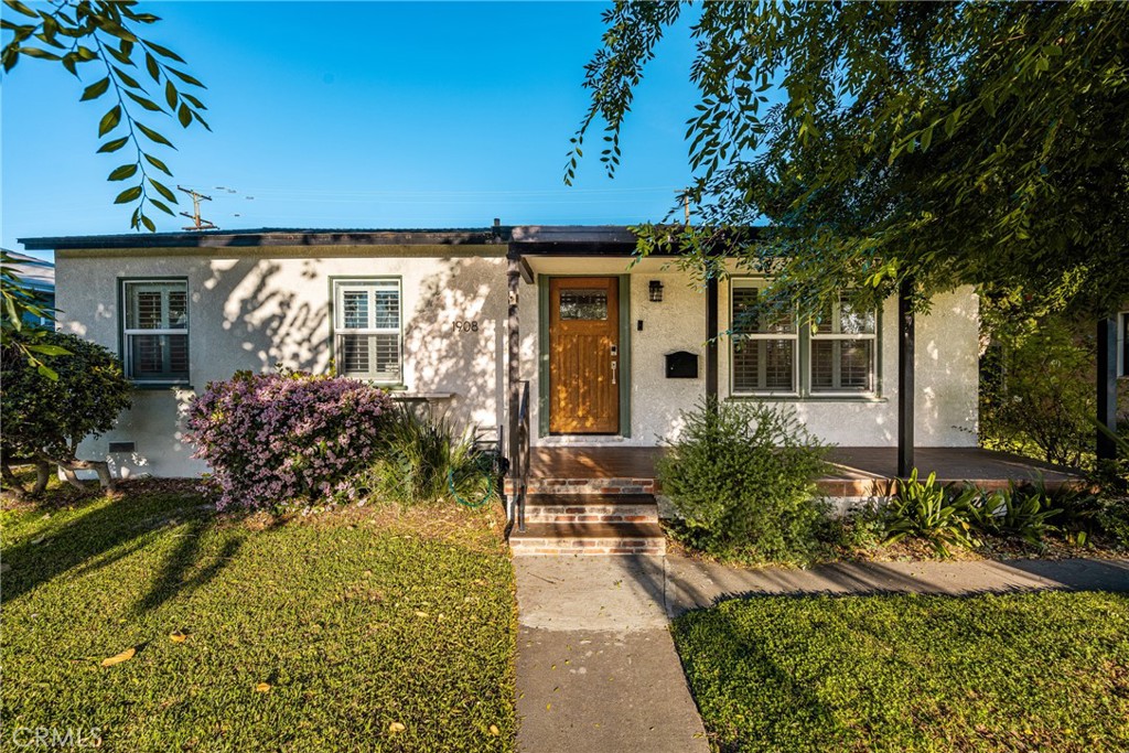 1908 Clark Avenue Long Beach, CA 90815 - Photo 1 of 1 a front view of a house with a yard