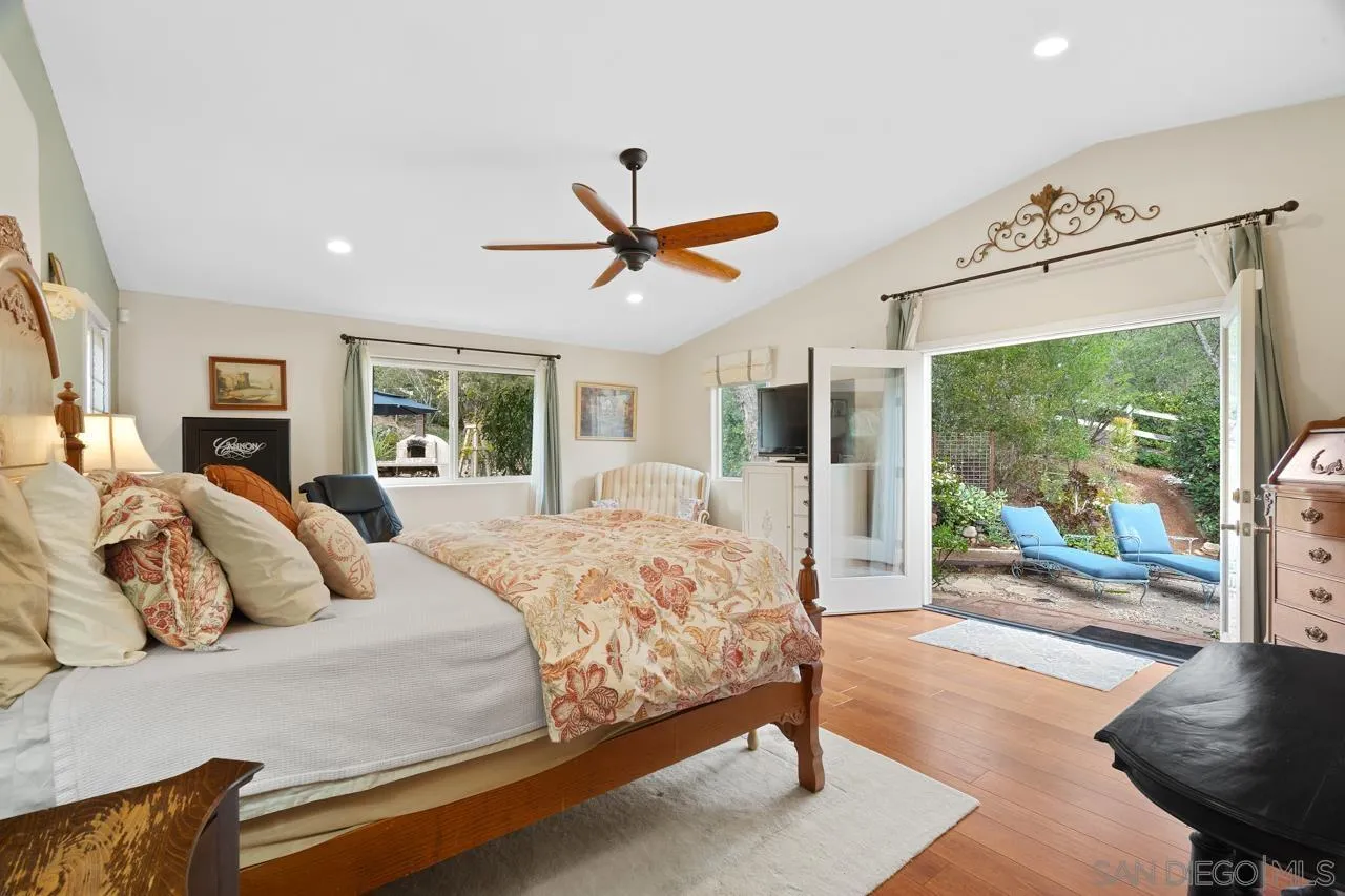 11116 Morning Dove Road Lakeside, CA 92040 - Photo 16 of 60 a bedroom with a large bed and a large window