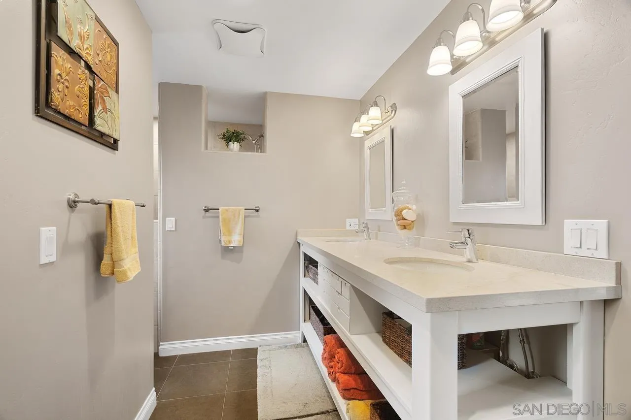 11116 Morning Dove Road Lakeside, CA 92040 - Photo 18 of 60 a en suite bathroom with a sink and a mirror