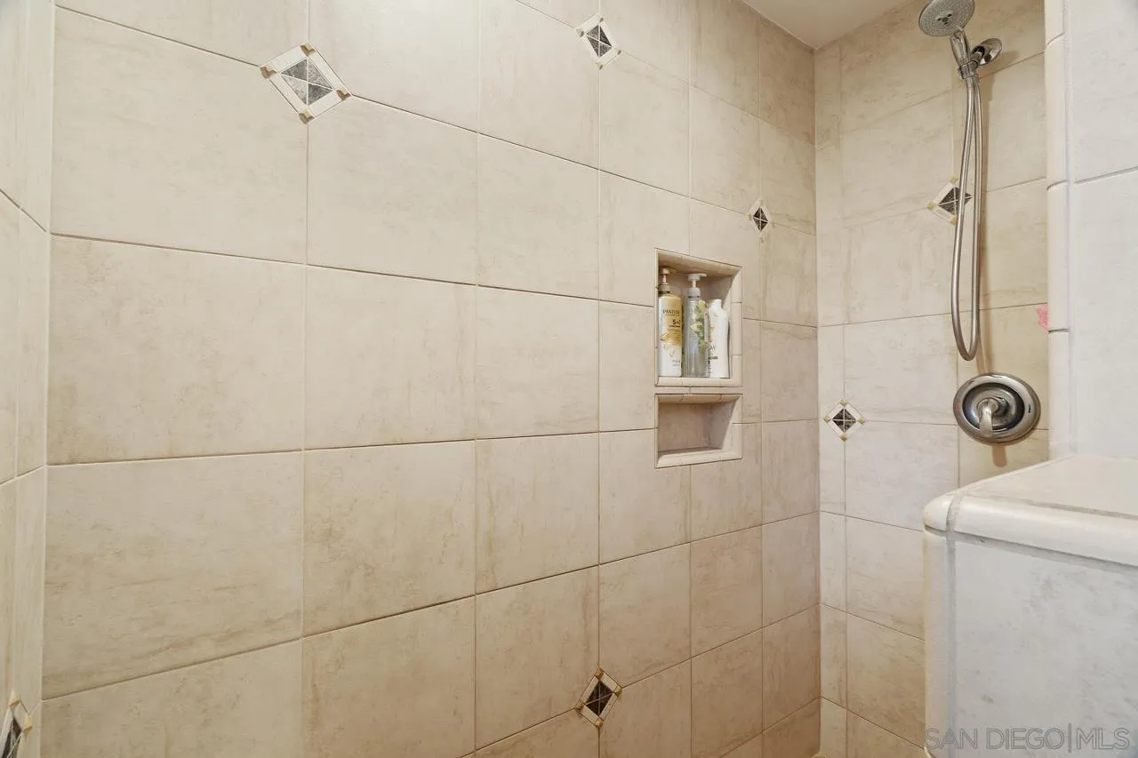 11116 Morning Dove Road Lakeside, CA 92040 - Photo 20 of 60 a bathroom with a toilet a sink and shower