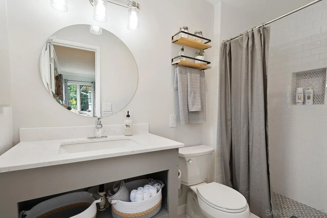 11116 Morning Dove Road Lakeside, CA 92040 - Photo 24 of 60 a bathroom with a sink a toilet and shower