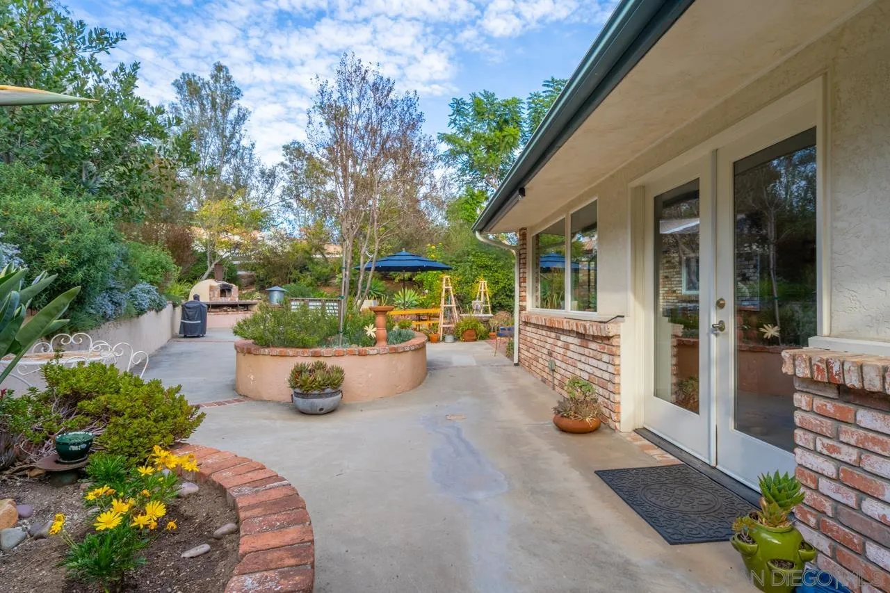 11116 Morning Dove Road Lakeside, CA 92040 - Photo 27 of 60 a view of a patio with couches table and chairs and potted plants