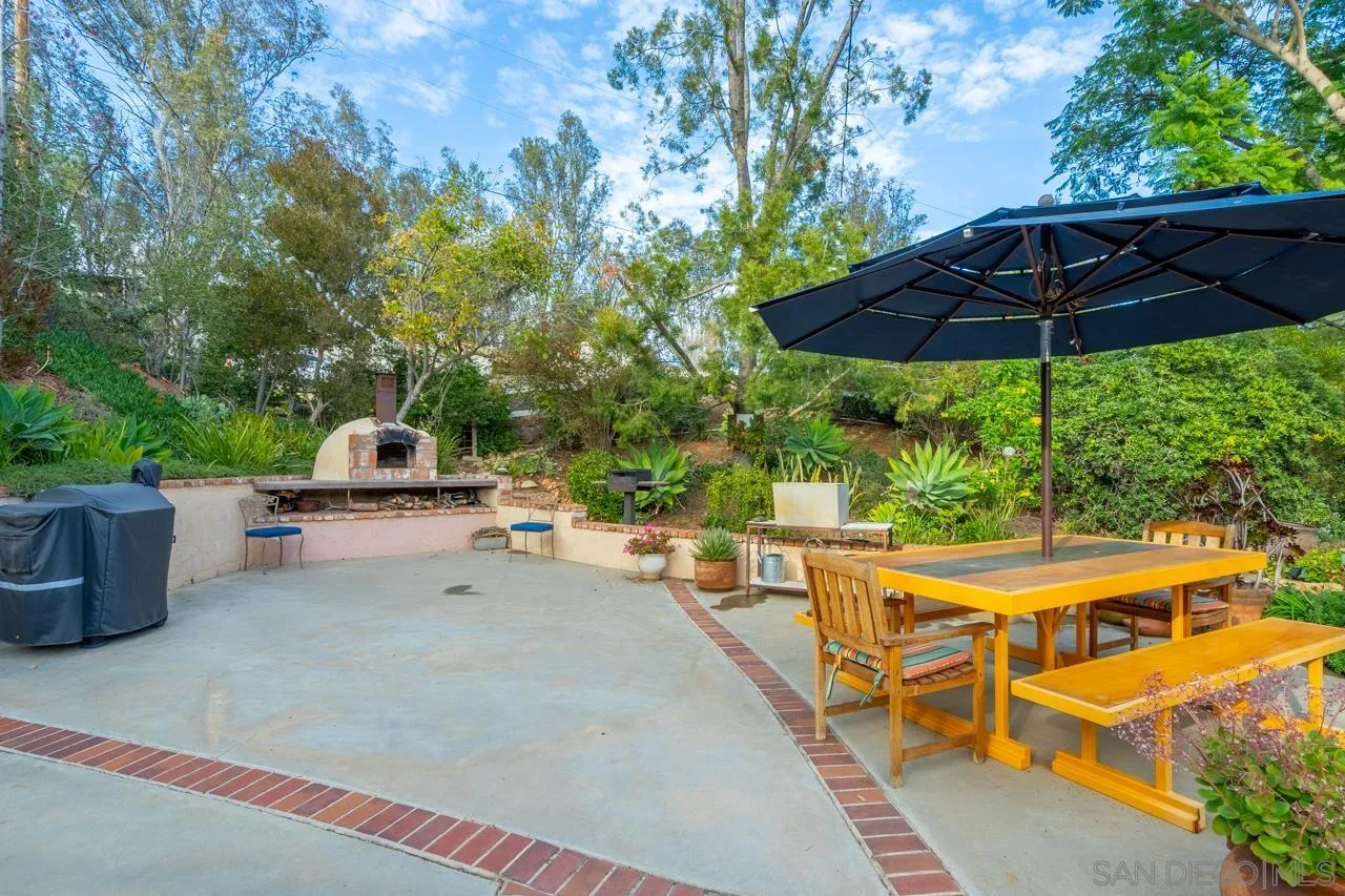 11116 Morning Dove Road Lakeside, CA 92040 - Photo 30 of 60 an outdoor space with furniture and umbrella