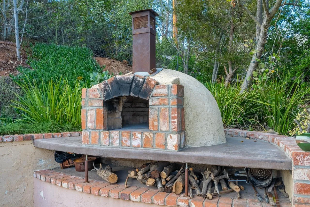 11116 Morning Dove Road Lakeside, CA 92040 - Photo 31 of 60 a backyard of a house with seating space and trees