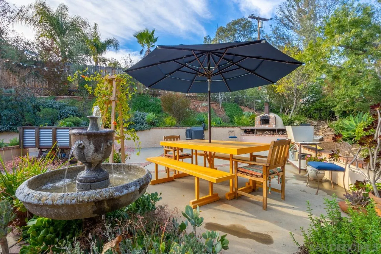 11116 Morning Dove Road Lakeside, CA 92040 - Photo 33 of 60 a view of a patio with table and chairs under an umbrella