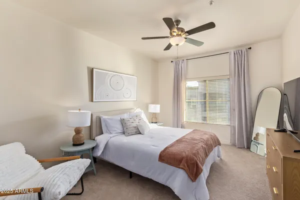 a bedroom with a bed and window