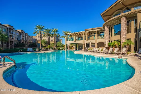 a view of a swimming pool with a bench