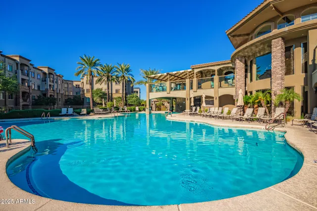 a view of a swimming pool with a bench