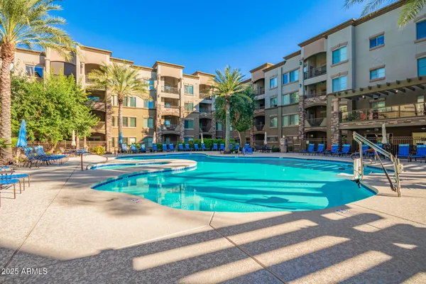 a view of a swimming pool with a patio