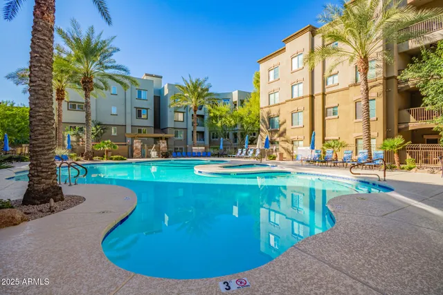 a front view of a building with sitting area