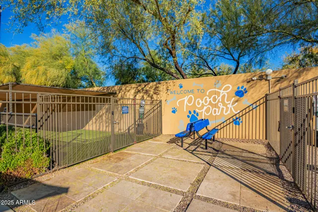 a kitchen with a table chairs and a kitchen