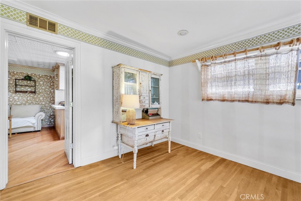 440 Cabrillo Street Costa Mesa, CA 92627 - Photo 11 of 36 a room with window and a wooden floor