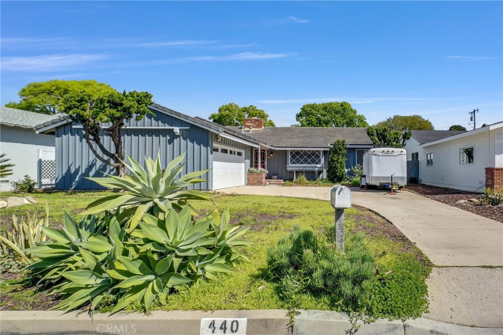 440 Cabrillo Street Costa Mesa, CA 92627 - Photo 2 of 36 a front view of a house with a garden