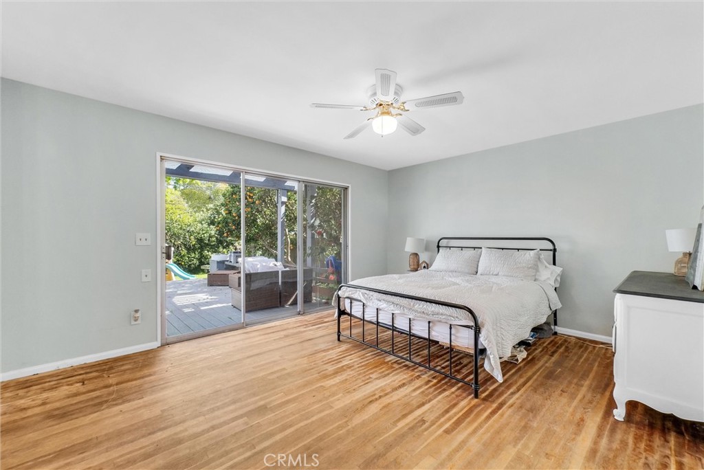 440 Cabrillo Street Costa Mesa, CA 92627 - Photo 24 of 36 a spacious bedroom with a bed and a large window