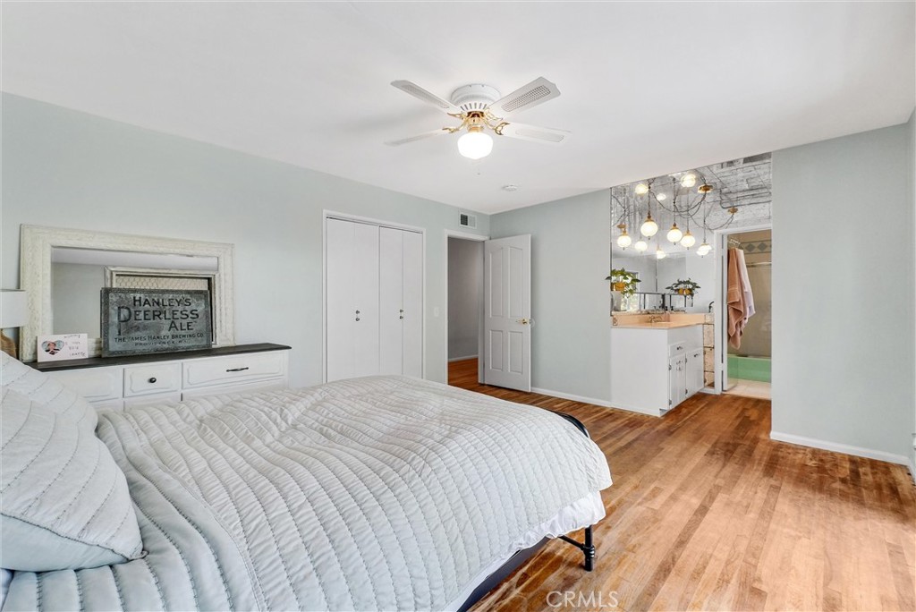 440 Cabrillo Street Costa Mesa, CA 92627 - Photo 25 of 36 a bedroom with a large bed and a chandelier