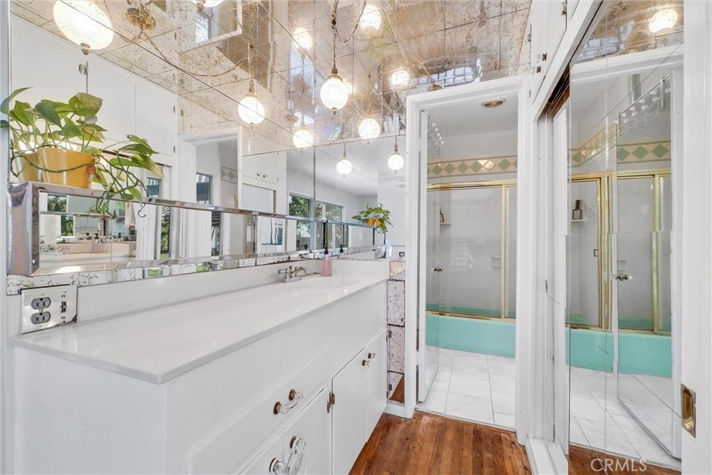 440 Cabrillo Street Costa Mesa, CA 92627 - Photo 26 of 36 a bathroom with a sink a mirror and a shower
