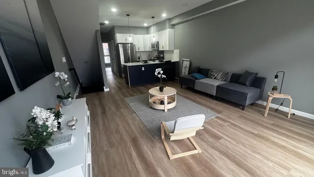 a view of hallway with wooden floor