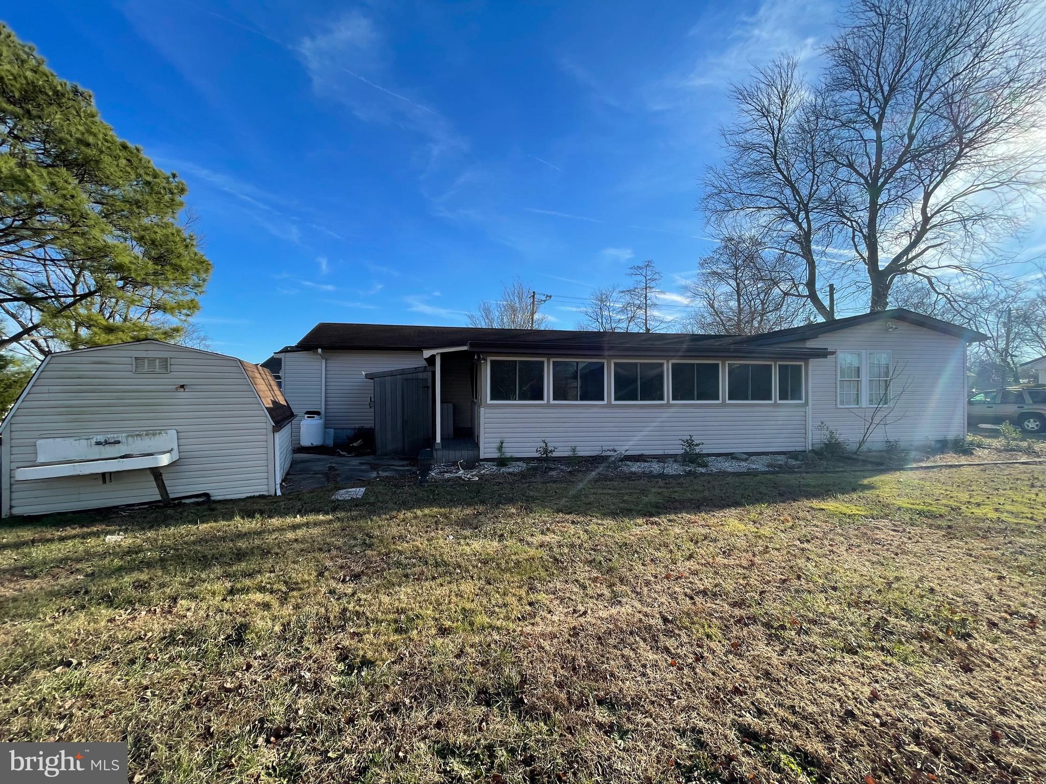 36907 Clubhouse Road Ocean View, DE 19970 - Photo 11 of 68 Rear Enclosed Porch for fun and gatherings.