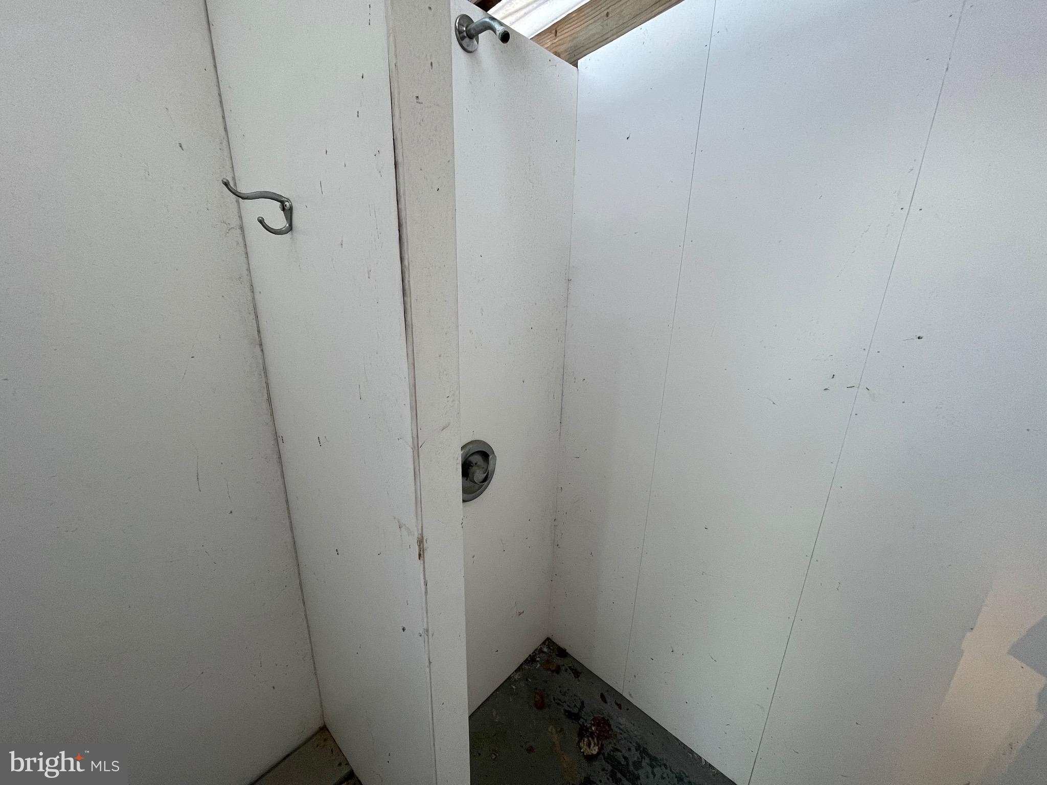 36907 Clubhouse Road Ocean View, DE 19970 - Photo 20 of 68 Out side shower for summer fun and clean up!