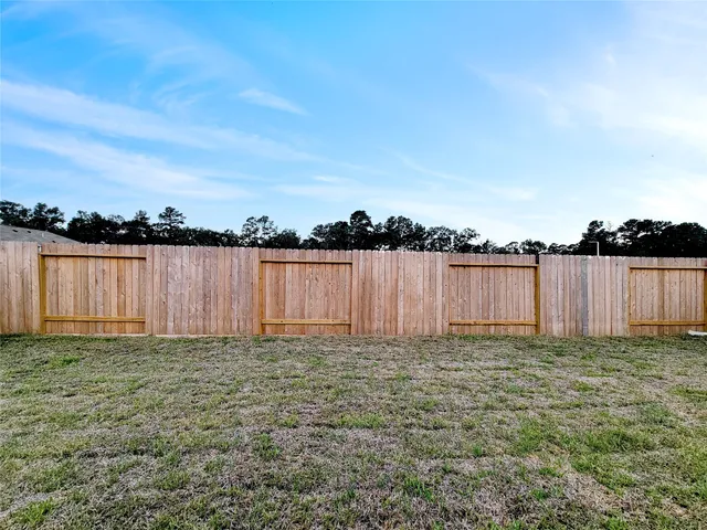 a view of a lake with houses in the background