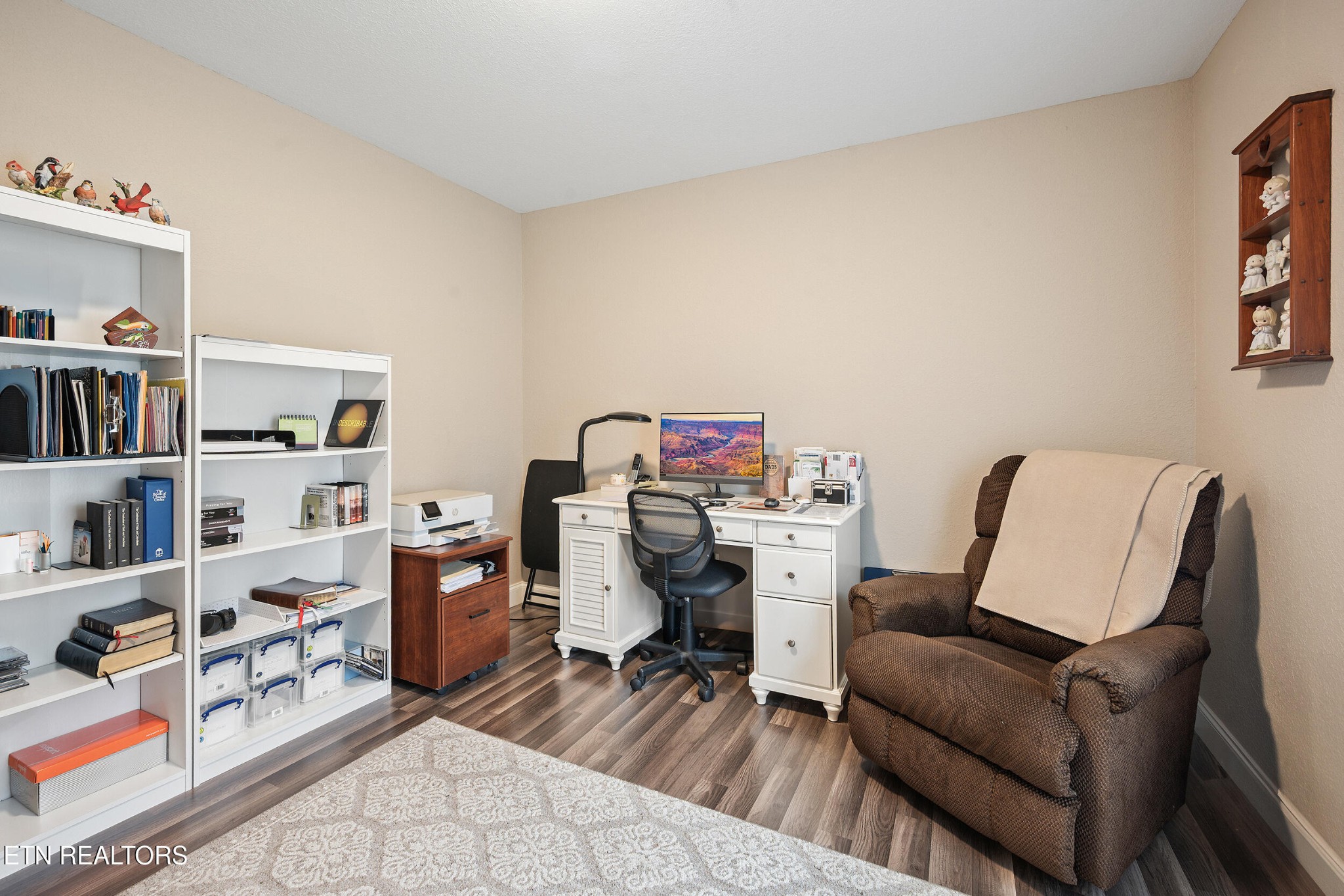 534 Shellbark Road Newport, TN 37821 - Photo 17 of 29 a view of a workspace with furniture and a book shelf