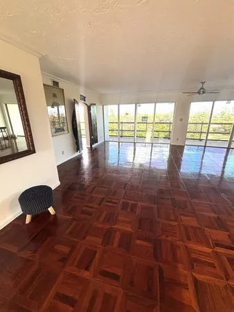 a lobby with furniture and floor to ceiling window