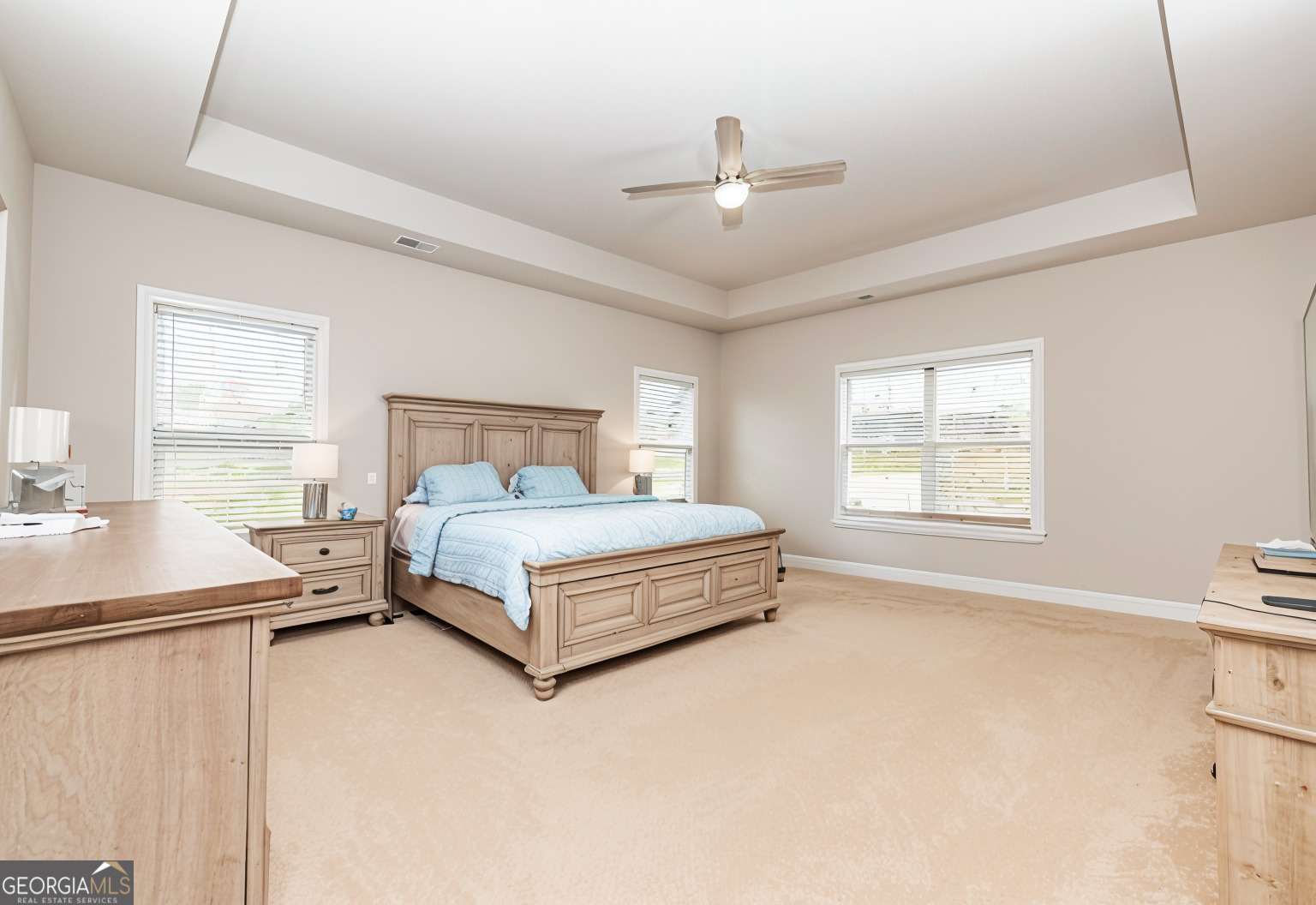 941 Highway 16 Newnan, GA 30263 - Photo 16 of 43 a spacious bedroom with a bed and window