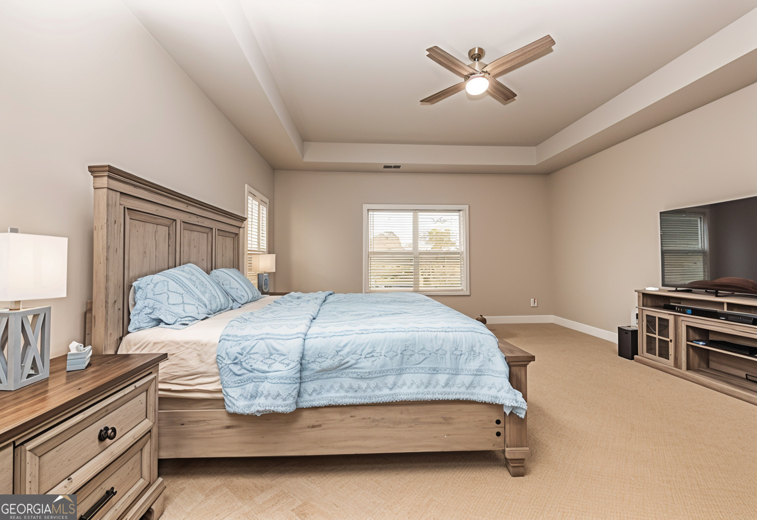 941 Highway 16 Newnan, GA 30263 - Photo 18 of 43 a bedroom with a large bed and a tv